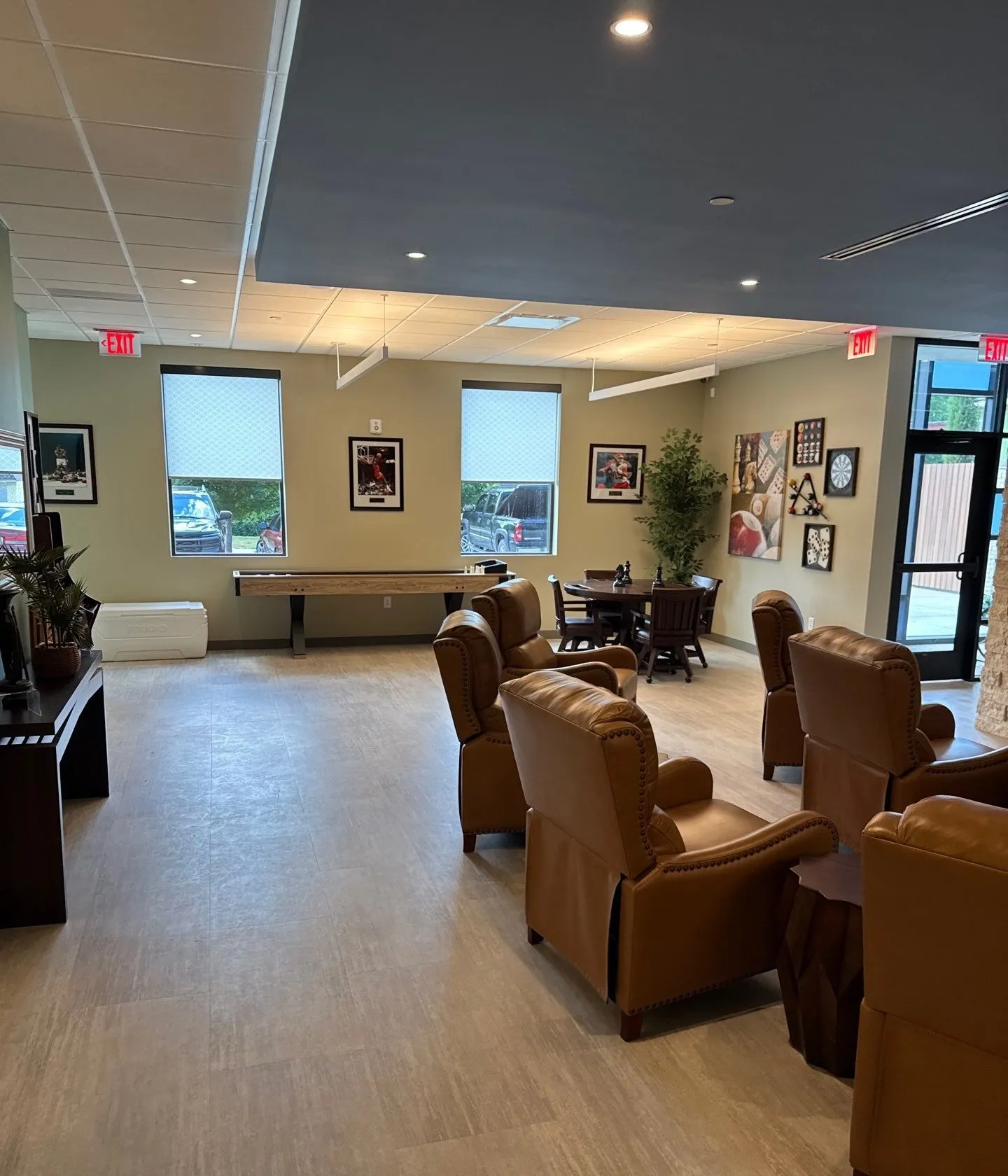 Finished commercial lounge with seating, flooring, and ceiling finishes in Kansas City